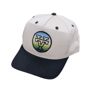Minimalist cap with embroidered VT logo and subtle serape accents, styled for everyday streetwear.